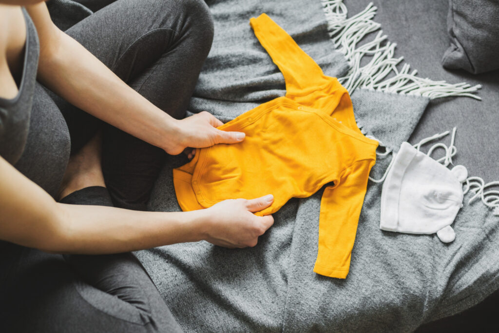 how to fold baby clothes